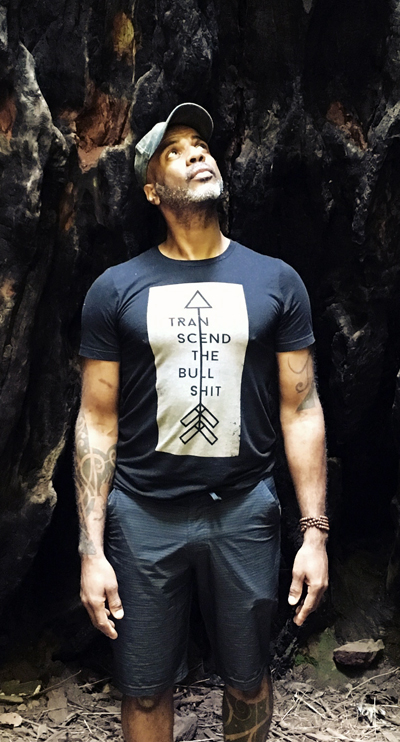 Image of Brent Harris, standing in a sunlit cave