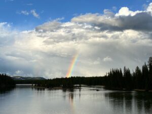 rainbow in the sky over a lake